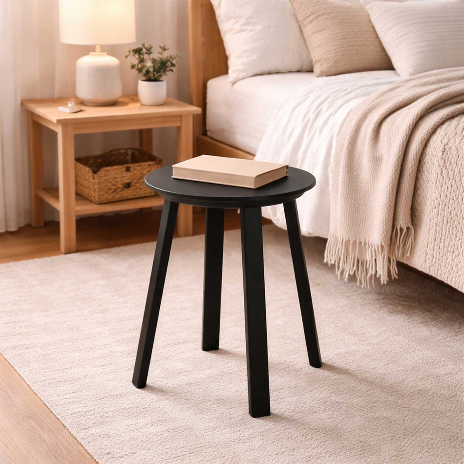 Round top wooden stool with tapered legs